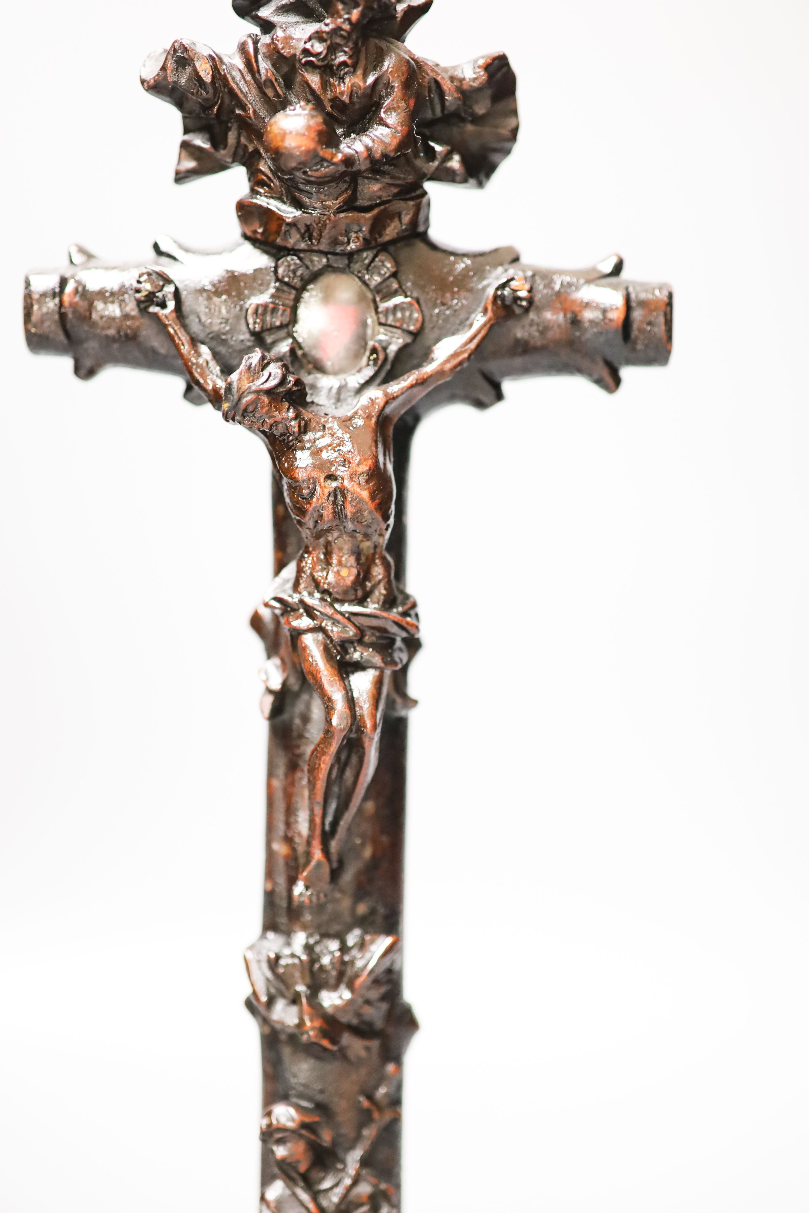 A carved wood crucifix 33cm